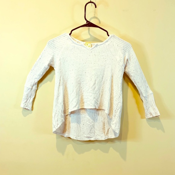 A white shite with black little fuzzys on it - Picture 1 of 2